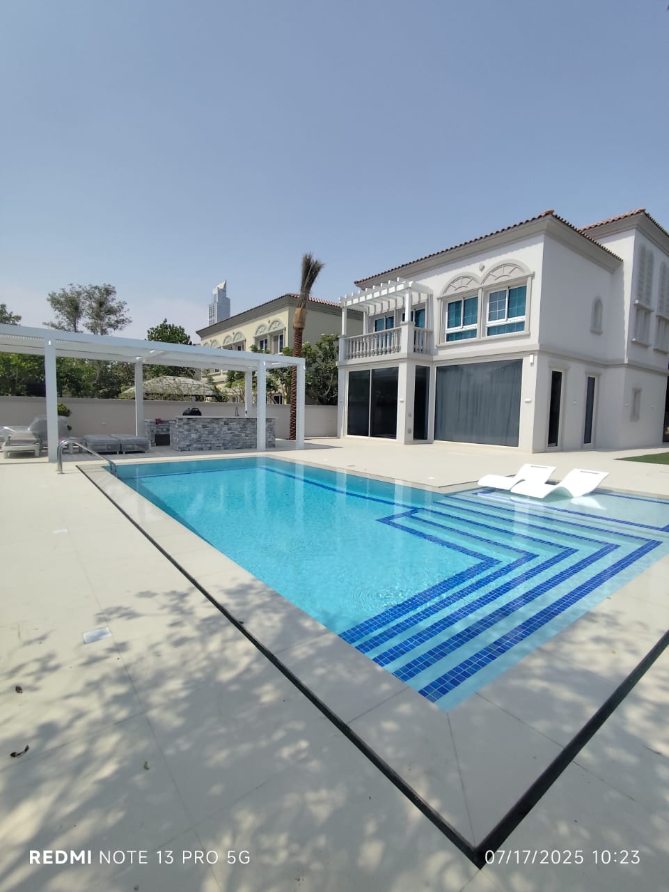 Villa pool with pergola and tiled entry steps